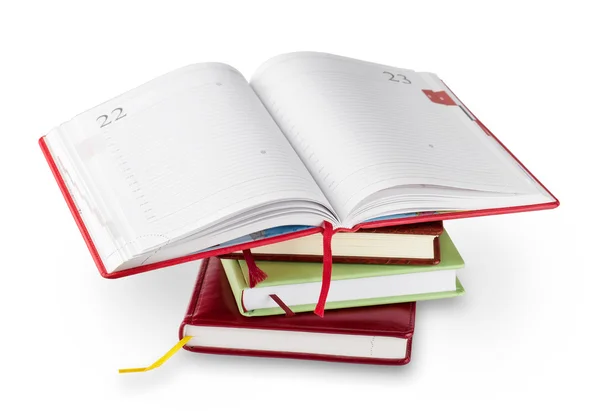 Stack of notebooks with red open top — Stock Photo, Image