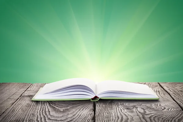 An open book on wooden table — Stock Photo, Image