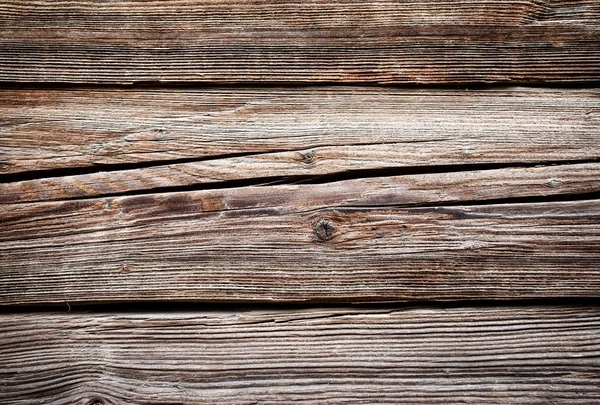 Bakgrund av spruckna grova plankor — Stockfoto