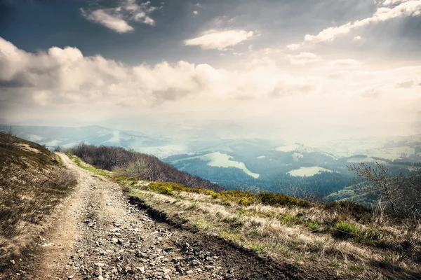 Turning rocky road in mountains