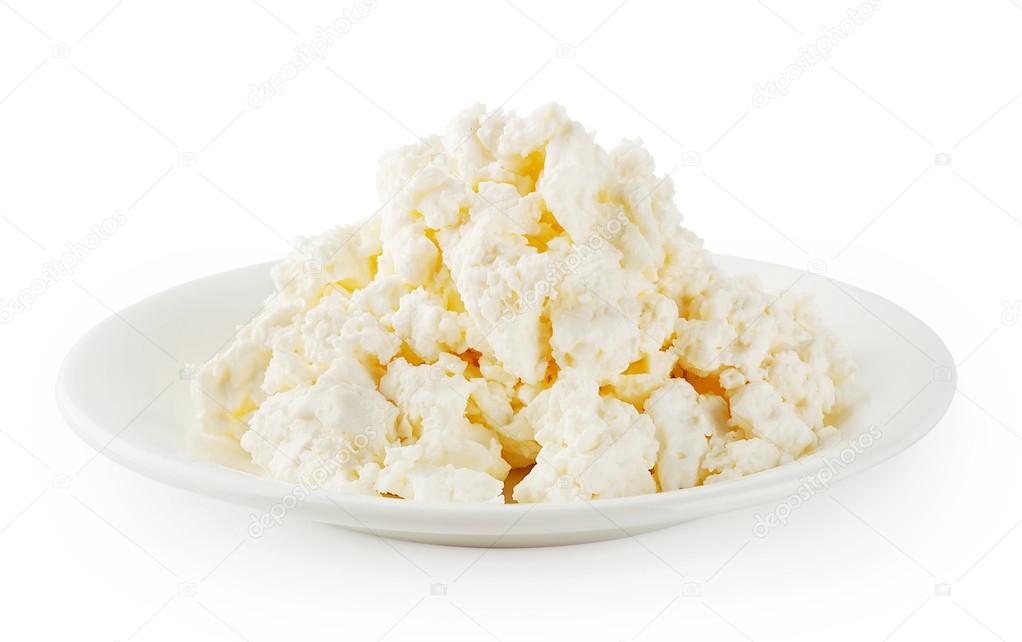 Fresh cottage cheese in round plate