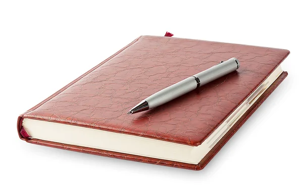 Tagebuch mit Stift darauf Stockfoto