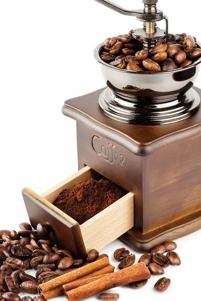 Coffee grinder with coffee beans and cinnamon — Stock Photo, Image