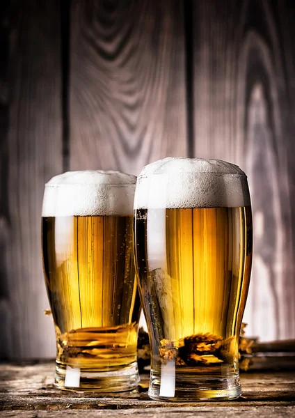 Two glasses of light beer with foam — Stock Photo, Image