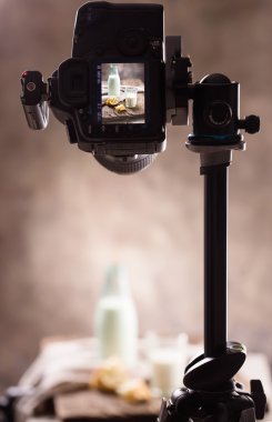 Photographing still-life with a bottle of milk clipart