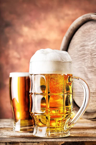 Mug and a glass of beer with keg — Stock Photo, Image