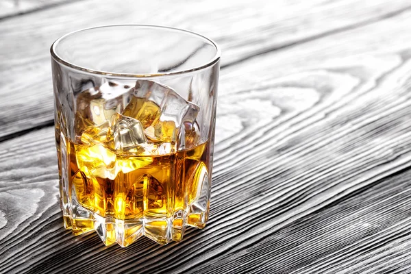 Glass of whiskey with ice — Stock Photo, Image