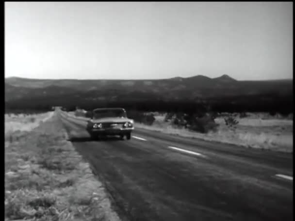 Car driving down country road — Stock Video