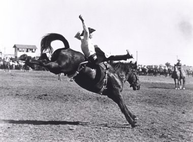 Eğilim bucking. Atlı kovboy