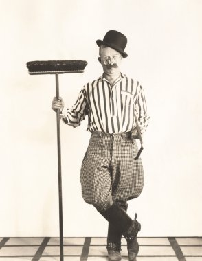 Man holding broom clipart