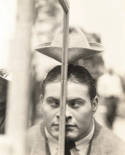 Young man and his reflection — Stock Photo, Image