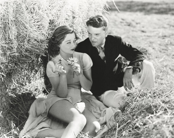 Man and woman sitting outdoors