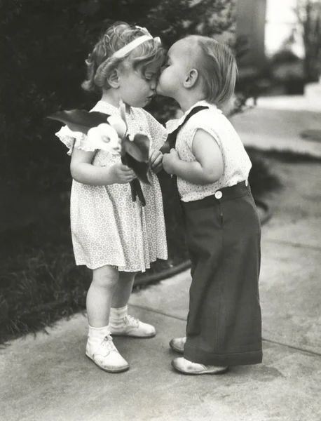 Cute boy kissing girl — Stock Photo, Image