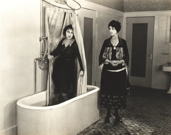 Woman hiding in bathroom — Stock Photo, Image