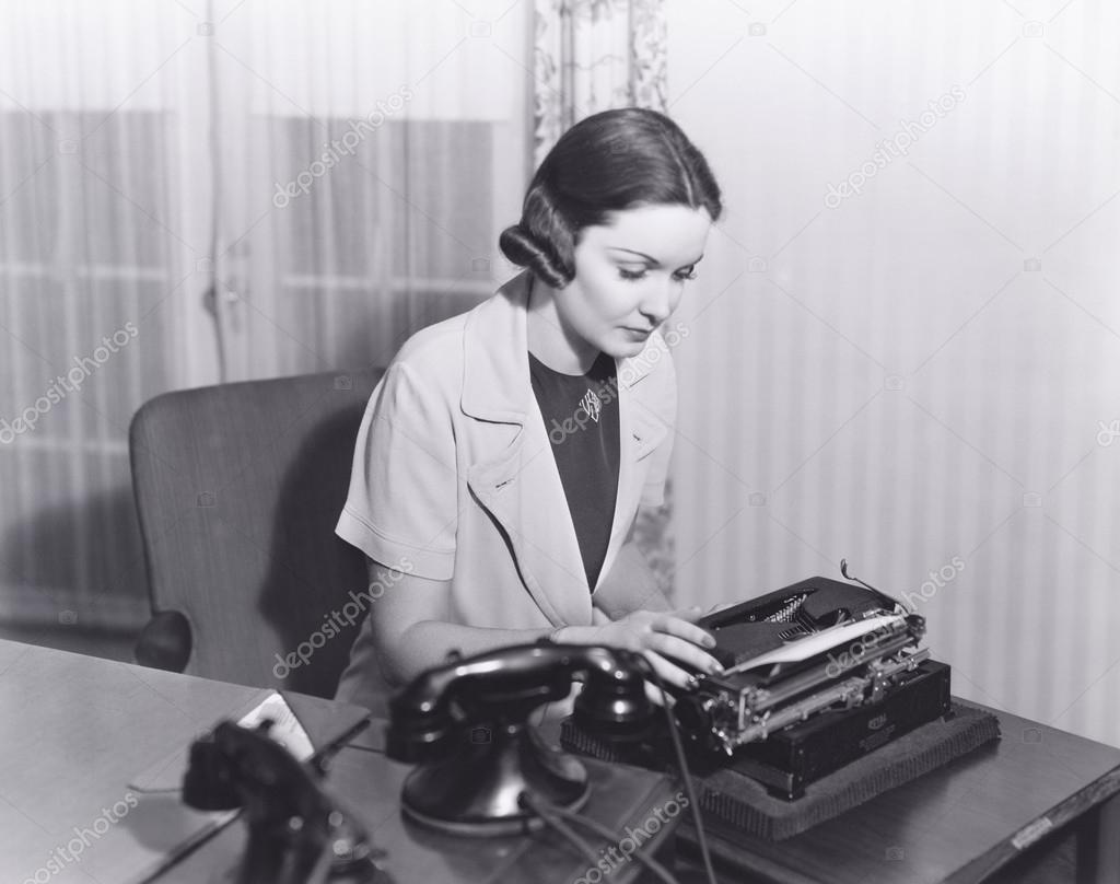 Woman typing a letter