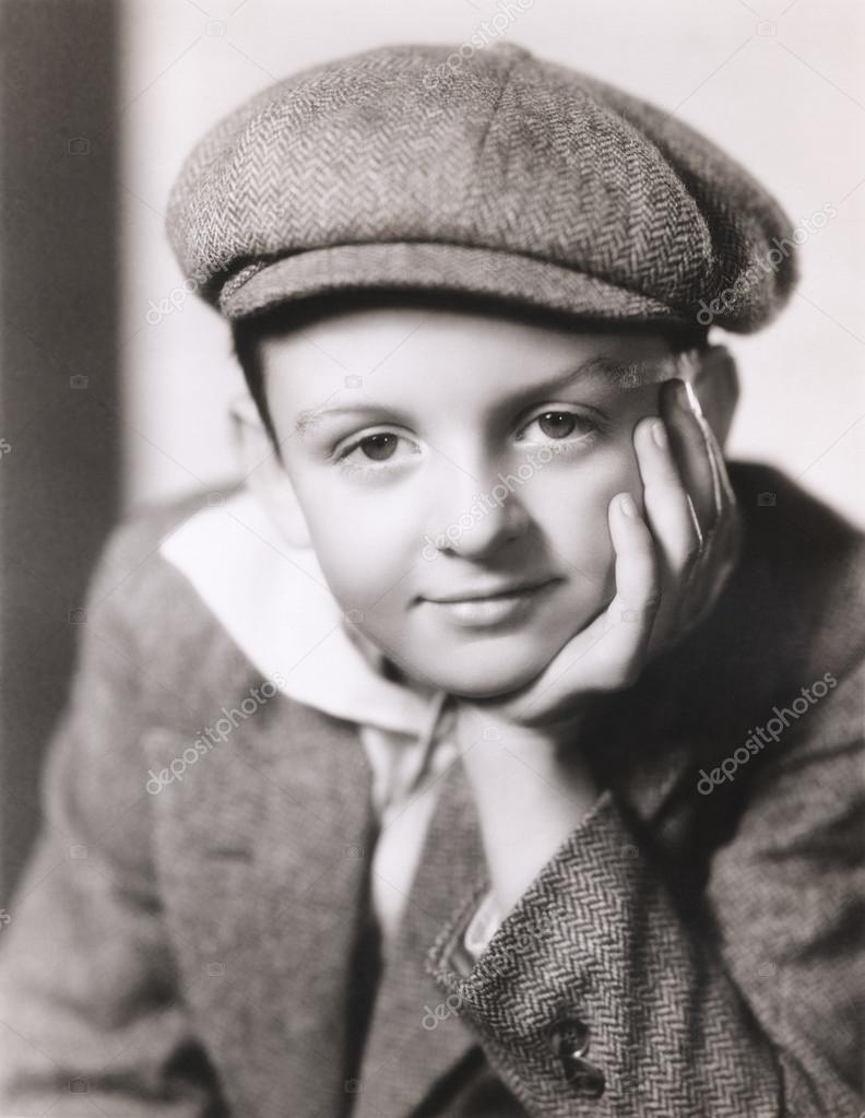 child  in newsboy cap