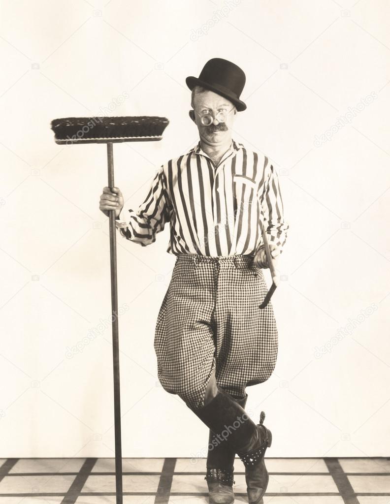 Man holding broom