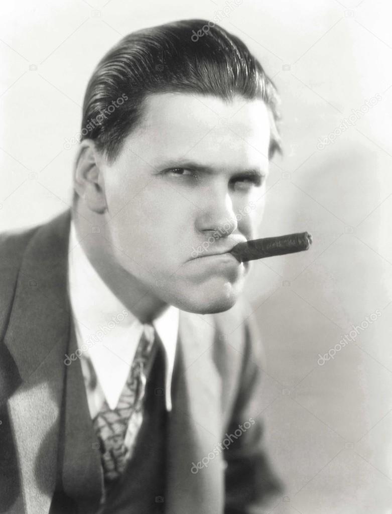 man Smoking a cigar with attitude
