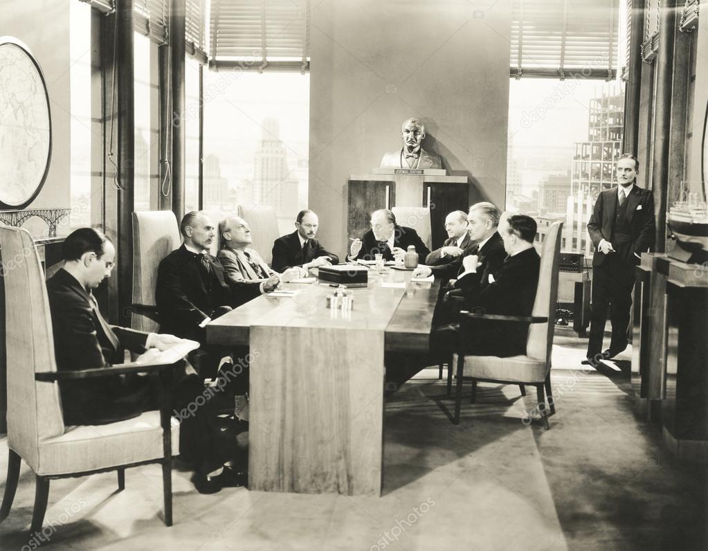 businessmen sitting at table