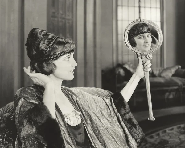 Woman admiring her hairstyle — Stock Photo, Image