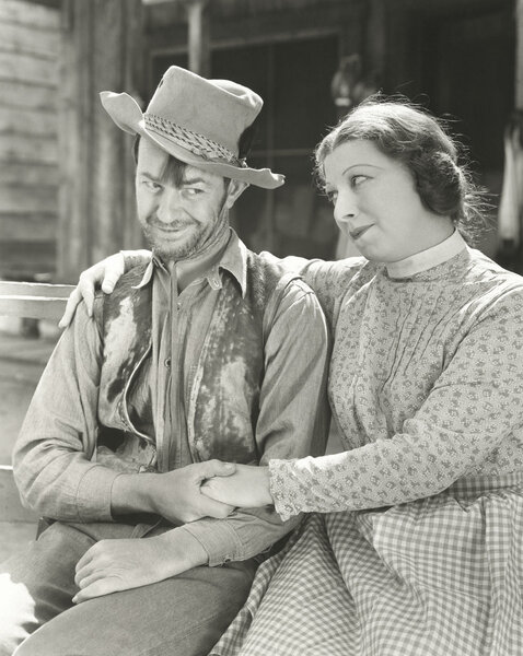 Affectionate cowboy with woman