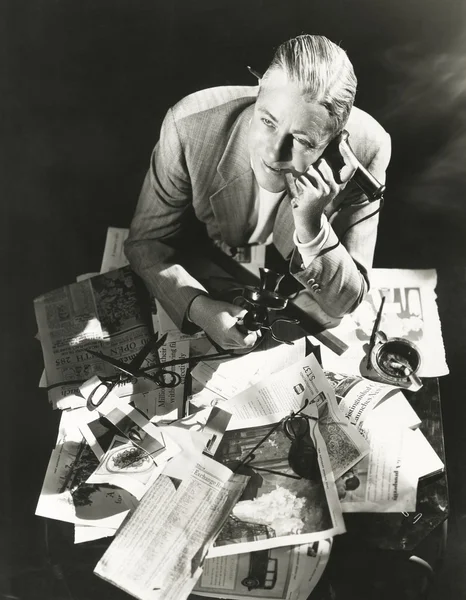 man Buired in paperwork