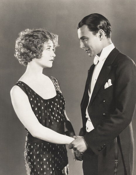 Man and woman holding hands