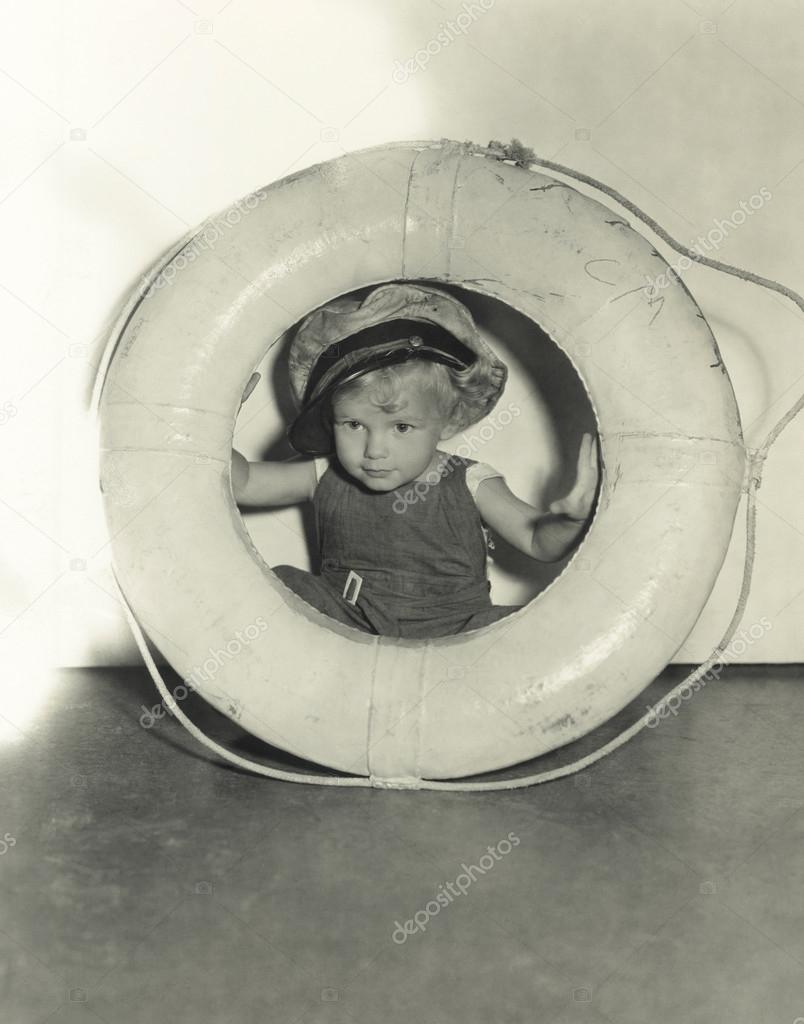 Young sailor with buoy