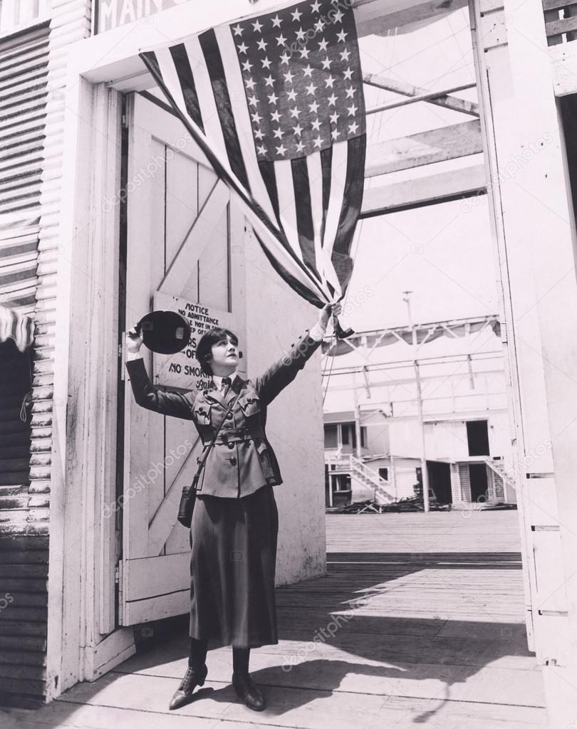soldier  holding American flag