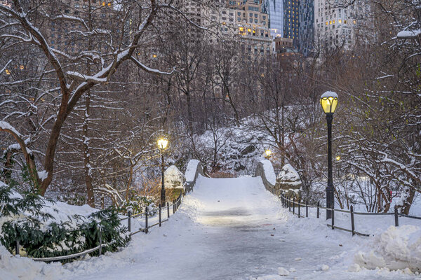 Gapstow Bridge in Central Park in winter during snow storm
