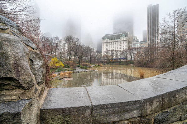 Gapstow Bridge in Central Park on foggy morning in spring