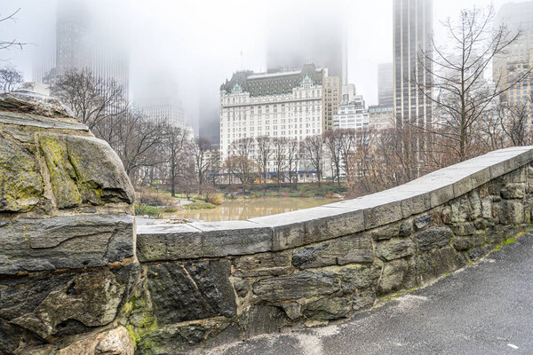 Gapstow Bridge in Central Park on foggy morning in spring