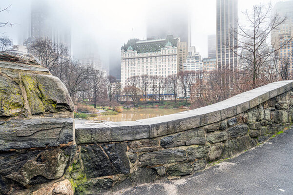 Gapstow Bridge in Central Park in early spring on foggy day