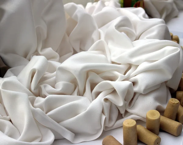 Cork stoppers with white tablecloth — Stock Photo, Image