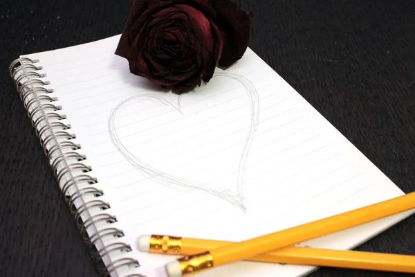 Jak napisać wiadomość i róża — Zdjęcie stockowe