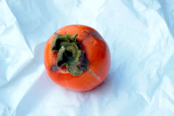 An autumnal persimmon — Stock Photo, Image