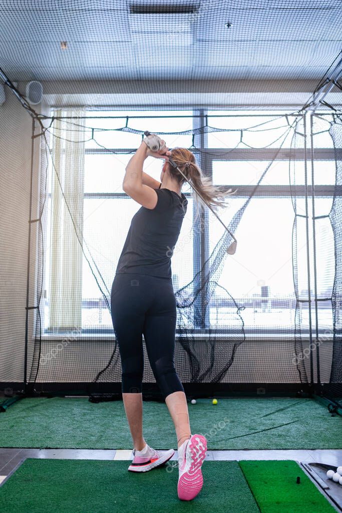 girl playing indoor golf