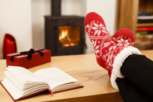 Cosy Christmas in front of wood burner — Stock Photo, Image