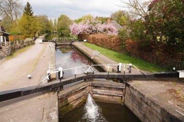 Canal lock and lock keepers cottage on the Grand Union Canal, London, UK clipart