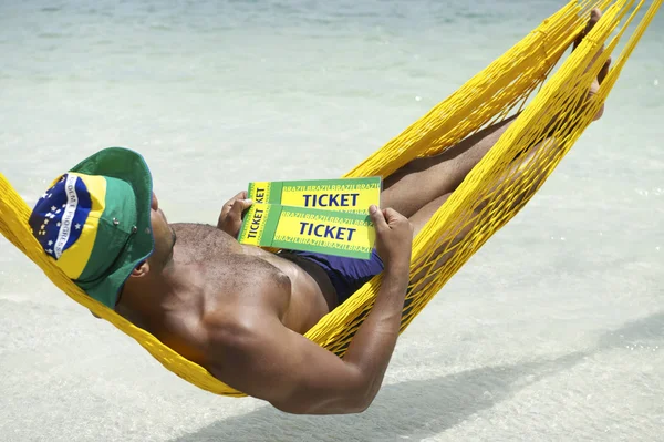 Brazilian Man Relaxing with Brazil Tickets — Zdjęcie stockowe