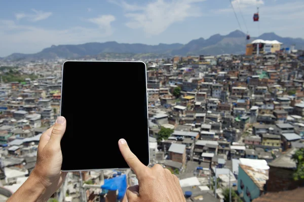 Hands Using Tablet at Brazilian Favela Urban Slum Rio de Janeiro