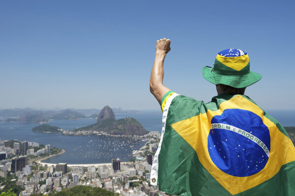 Patriotic Brazil Fan Standing Wrapped in Brazilian Flag Rio