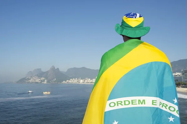 Brazilian Wrapped in Flag at the Sea — Stok fotoğraf