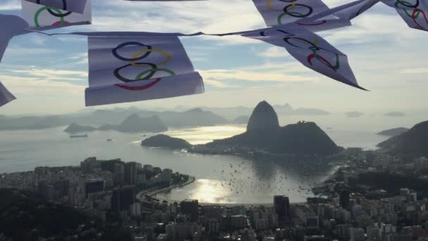Olympic Flag Bunting Waving at Rio de Janeiro Skyline Overlook — Stock Video