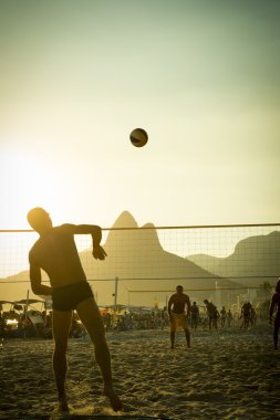 Brazilians Playing Beach Volleyball Rio de Janeiro Brazil Sunset clipart