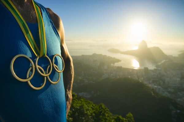 Olympic Rings Gold Medal Athlete Rio de Janeiro Sunrise Stock Photo