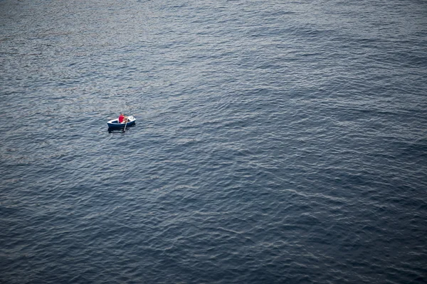 Lonely Rowboat on a Large Expanse of Sea — стокове фото