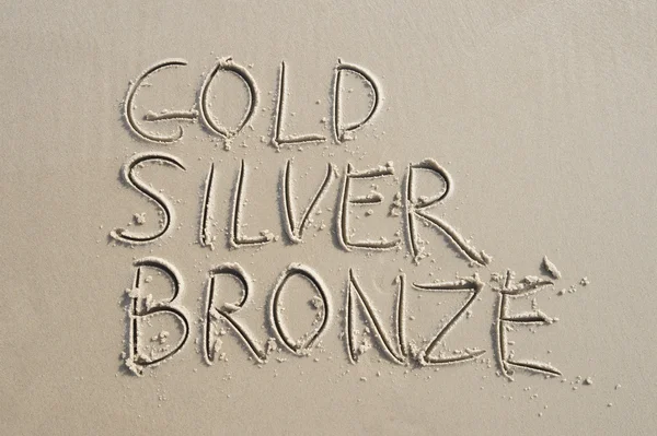 Gold Silver Bronze Message sur Smooth Sand — Photo