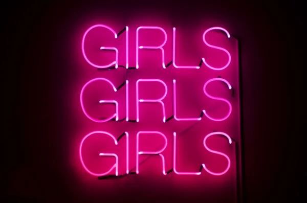 Girls Girls Girls Sign in Pink Neon ストック画像