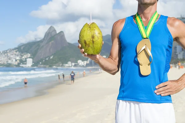 Champion Gold Medal Flip Flop Athlete Celebrating with Coconut Rio — Stock Photo, Image